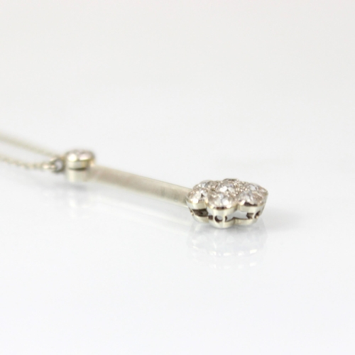 202 - An Edwardian diamond necklace, the old cut diamond suspending knife edge bar with old cut diamond cl... 