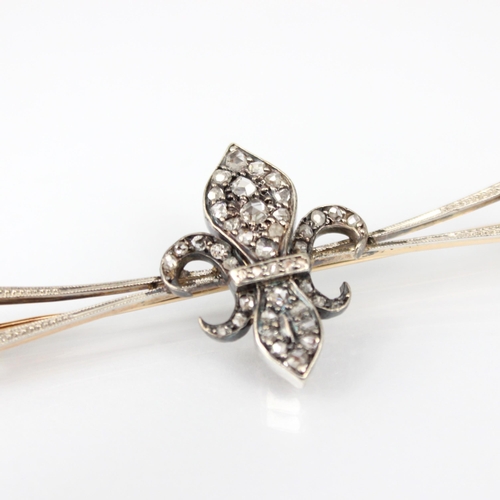 235 - A late 19th century diamond brooch, the central fleur de lis designed motif set with rose cut diamon... 