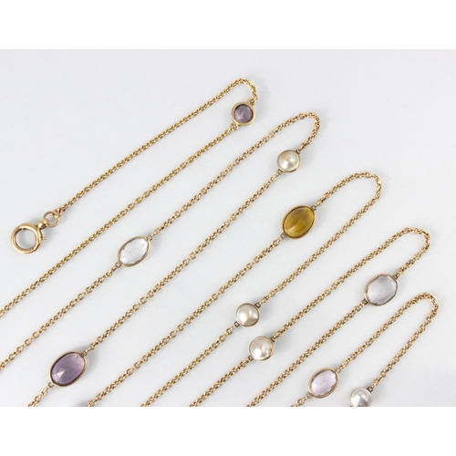 273 - A 20th century spectacle set blister pearl and gemstone set long guard chain, the trace link yellow ... 