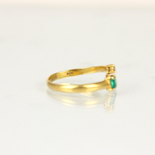 299 - A bespoke diamond and untested emerald ‘toi et moi’ ring, the square cut emerald within yellow metal... 