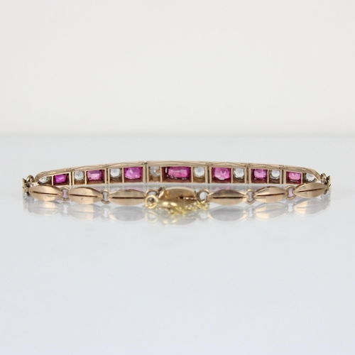 301 - A 20th century untested ruby and white sapphire bracelet, the seven mixed cut untested rubies within... 