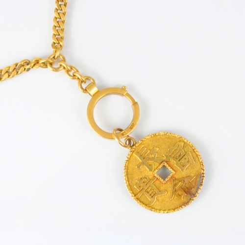 306 - A yellow metal Asian watch chain, the curb link chain suspending locket compass, stamped ‘k18’ and a... 