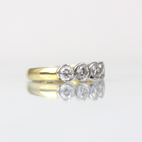 325 - An 18ct yellow gold diamond five stone ring, the five round cut diamonds in white metal twist rub ov... 