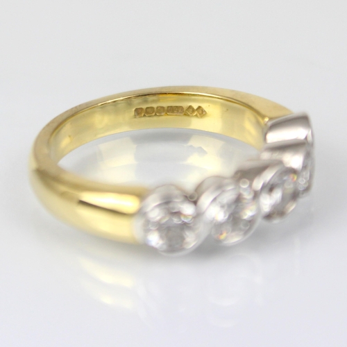 325 - An 18ct yellow gold diamond five stone ring, the five round cut diamonds in white metal twist rub ov... 