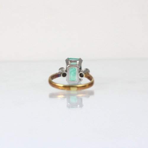 331 - An Edwardian style untested emerald and diamond three stone ring, the emerald cut untested emerald w... 