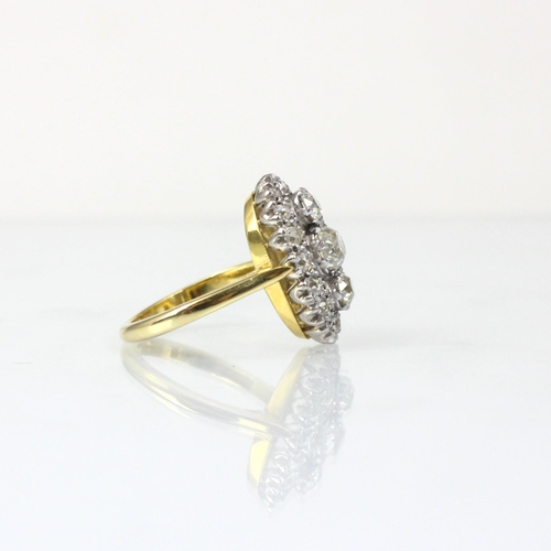 343 - An Edwardian style diamond cluster ring, the three graduated old cut diamond centre within surround ... 