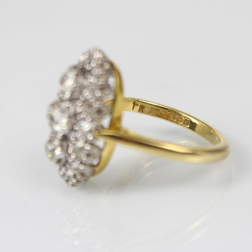 343 - An Edwardian style diamond cluster ring, the three graduated old cut diamond centre within surround ... 