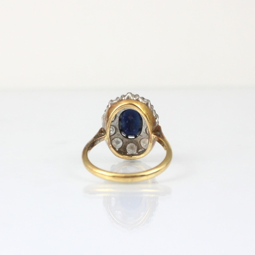 345 - An Edwardian style diamond and untested sapphire cluster ring, the central oval cut untested sapphir... 