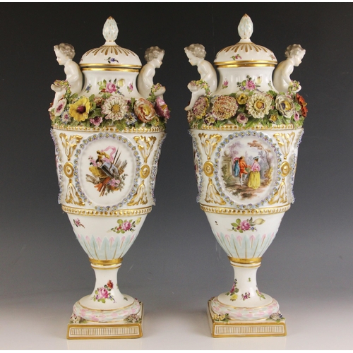 596 - A pair of continental porcelain vases in the manner of Meissen, 19th century, each of urn form, the ... 