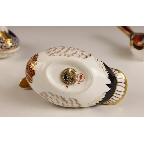 598 - A Royal Crown Derby paperweight modelled as a long tailed tit, gold stopper, printed mark for 2005; ... 