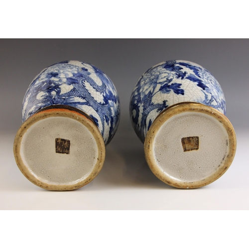 637 - A pair of Chinese porcelain blue and white vases, 19th century, each vase of baluster form and decor... 