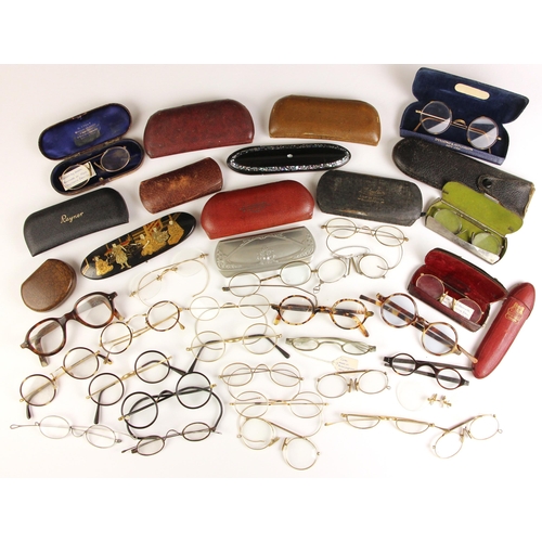 740 - A large collection of vintage spectacles, late 19th century and later, various sizes, to include som... 