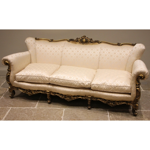 1002 - A French Louis XVI style giltwood and composite framed sofa, mid 20th century, in ivory coloured lat... 