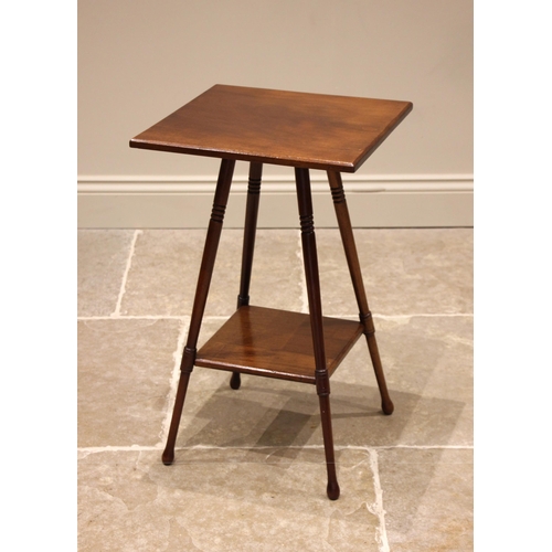 1004 - An Edwardian mahogany occasional table in the manner of E.W Godwin, the square top upon ring turned ... 