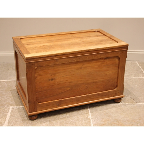 1019 - A contemporary hardwood trunk, the 'framed' and moulded cover opening to a vacant interior, with con... 