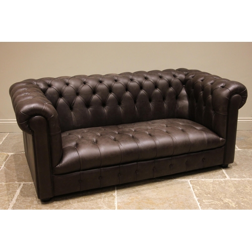 1020 - A nut brown leather Chesterfield sofa, late 20th/early 21st century, of typical deep set form, with ... 