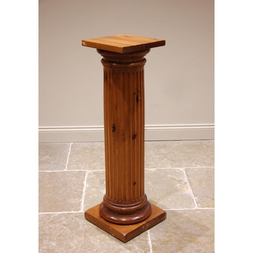 1027 - A contemporary pine Corinthian column pedestal, of typical fluted cylindrical form, upon an integral... 