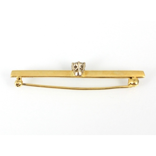 209 - A yellow metal diamond set bar brooch, the central round cut diamond upon yellow metal knife edge ba... 