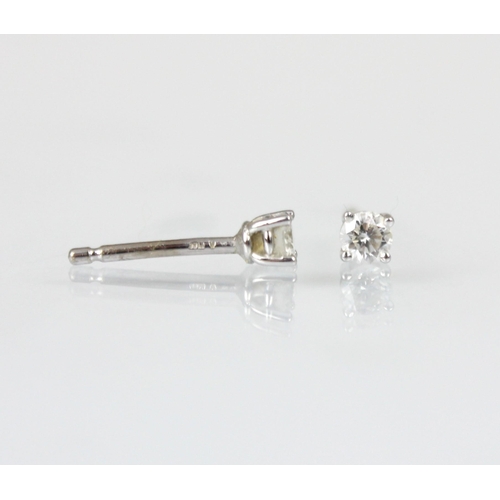 210 - A pair of 18ct white gold diamond stud earrings, the round cut diamonds in claw setting edge leading... 