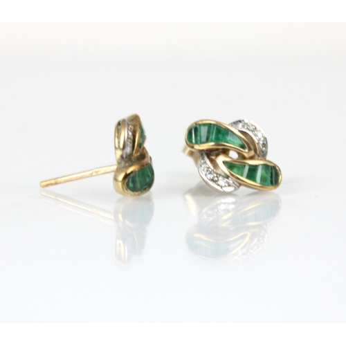 211 - A pair of 9ct yellow gold emerald and diamond stud earrings, the organically designed earrings with ... 