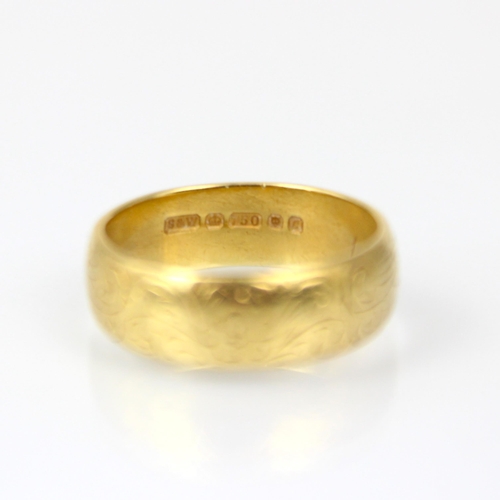 215 - An 18ct yellow gold wedding band, with engraved decoration to front, stamped 'S&W' London 1977, ring... 