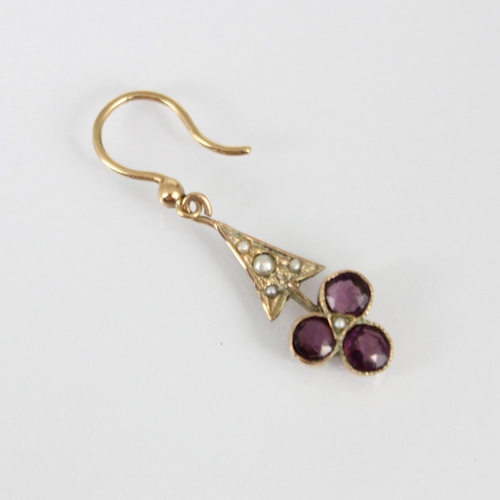 228 - A pair of early 20th century amethyst and seed pearl earrings, the trefoil designed round cut amethy... 