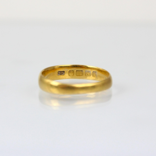 244 - An early 20th century 22ct yellow gold wedding band, stamped 'SH' Birmingham 1909, ring size N 1/2, ... 