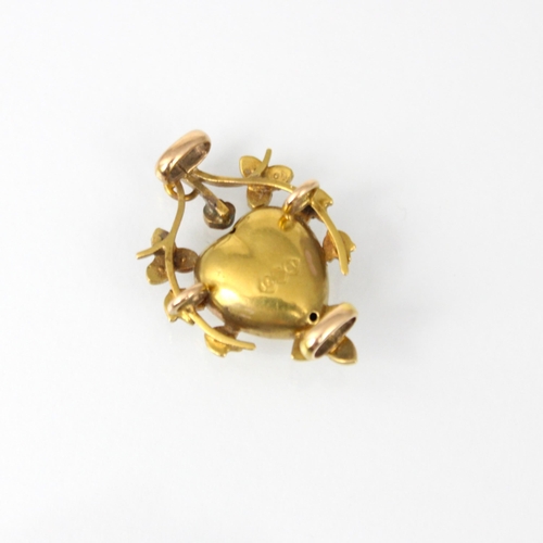 245 - A late 19th/early 20th century yellow gold pendant, the central heart shaped motif set with blue sto... 