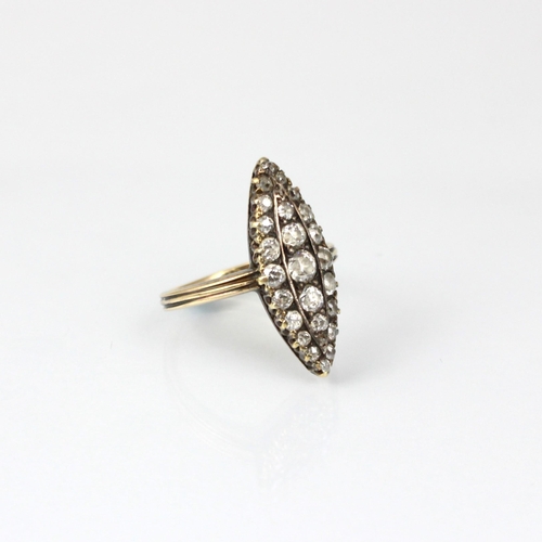 253 - A 19th century diamond marquise ring, the twenty seven mixed cut diamonds within a white metal claw ... 