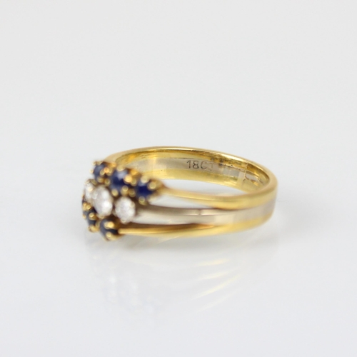 265 - A 20th century triple row diamond and untested sapphire ring, the central three graduated round cut ... 