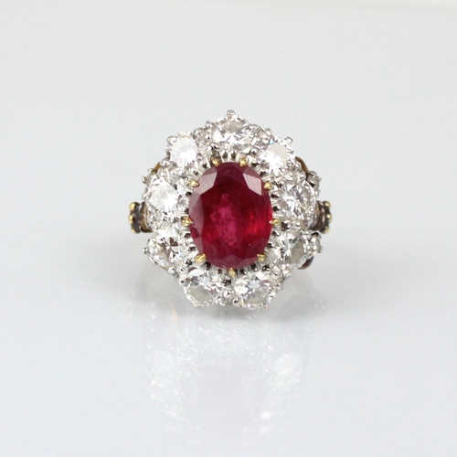 267 - An Edwardian style untested ruby and diamond ring, the central oval cut untested ruby within surroun... 