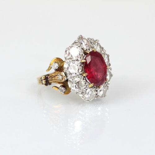 267 - An Edwardian style untested ruby and diamond ring, the central oval cut untested ruby within surroun... 