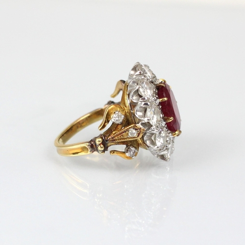 267 - An Edwardian style untested ruby and diamond ring, the central oval cut untested ruby within surroun... 