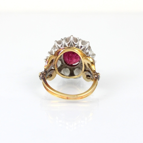 267 - An Edwardian style untested ruby and diamond ring, the central oval cut untested ruby within surroun... 