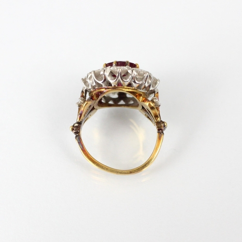 267 - An Edwardian style untested ruby and diamond ring, the central oval cut untested ruby within surroun... 