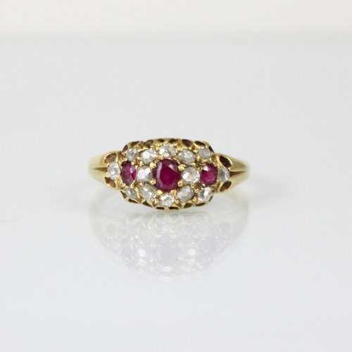 289 - A 19th century diamond and untested ruby ring, the central cushion cut stone with smaller cushion cu... 