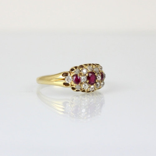 289 - A 19th century diamond and untested ruby ring, the central cushion cut stone with smaller cushion cu... 