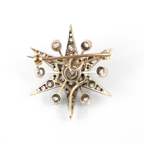 355 - A 19th century diamond brooch/pendant, the central old cut diamond within stylised flowerhead, encom... 