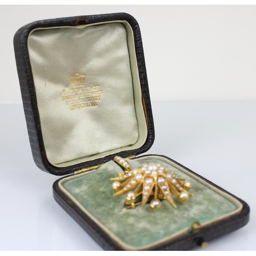 356 - A late 19th century split pearl brooch/pendant, the raised flowerhead designed centre within a star ... 