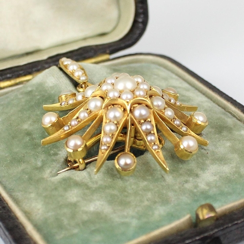 356 - A late 19th century split pearl brooch/pendant, the raised flowerhead designed centre within a star ... 