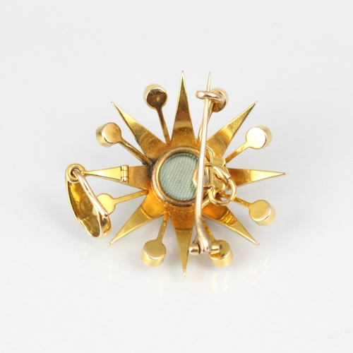 356 - A late 19th century split pearl brooch/pendant, the raised flowerhead designed centre within a star ... 