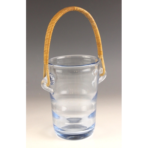 528 - A Danish blue glass ice pail by Holmegaard, the rattan handle attached on prunted ribbed glass loops... 