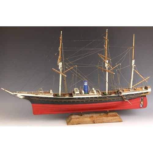 675 - A wooden model of a three masted steam yacht, 20th century, with painted hull, extensive rigging and... 