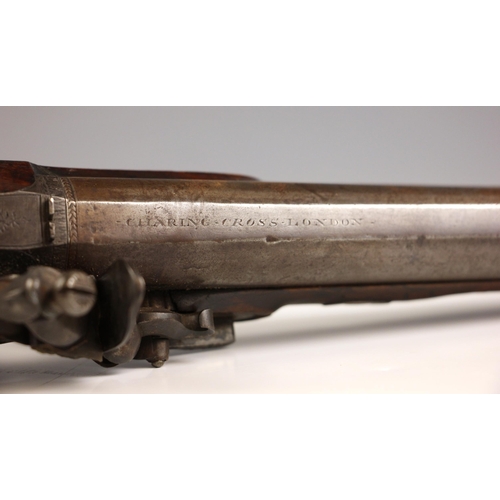 718 - An officer's Flintlock pistol by Prosser, early 19th century, the sighted barrel engraved 'Charing C... 