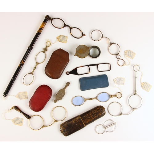 737 - A Victorian folding lorgnette, late 19th century, the rectangular lenses retracting to a shaped silv... 