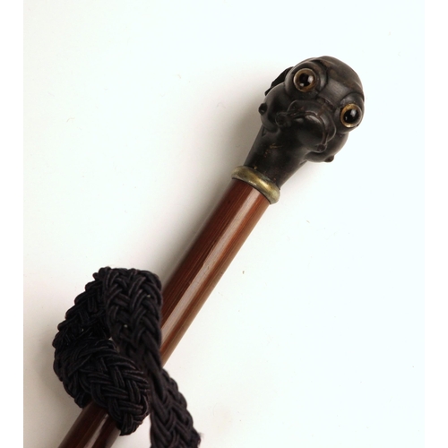 742 - A child’s parasol, 19th century, the handle with carved wooden dog mask terminal, re-covered in late... 