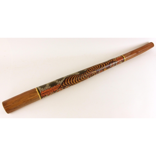 747 - An Australian Didgeridoo, late 20th century, of traditional form, dot painted with a stylised lizard... 