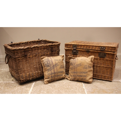 748 - A wicker log basket, applied with rope side handles, upon wooden slats, 58cm H x 85cm W x 64cm D, al... 