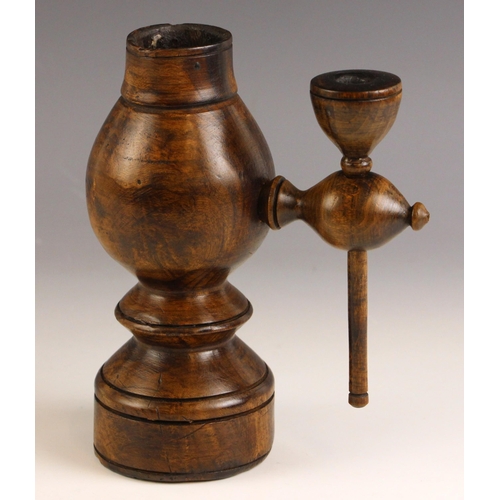 757 - A 19th century treen candle holder, of swelling form, with applied side holder for candle dampener, ... 