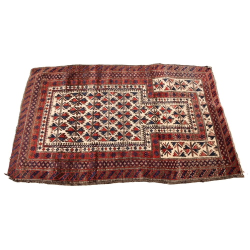 804 - An Afghan Baluchi wool pile prayer rug, in red, blue and ivory colourways, the central field overlai... 